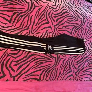 Black Adidas leggings with the white lines and logo on both sides.